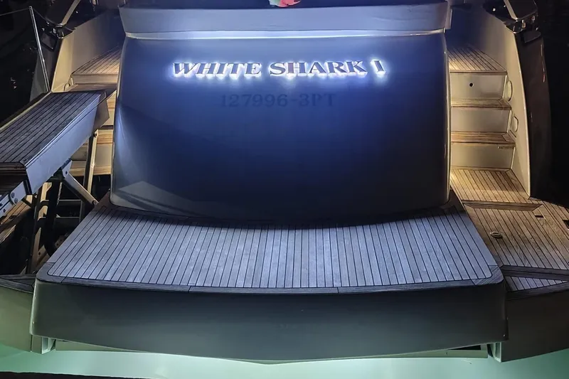 White Shark I Yacht Photos Pics 2010 Pershing 72 yacht "White Shark I" illuminated at night, rear view.