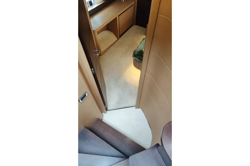 White Shark I Yacht Photos Pics Interior view of 2010 Pershing 72 yacht, featuring wooden stairs and modern design.