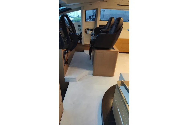 White Shark I Yacht Photos Pics Interior of 2010 Pershing 72 yacht with leather seats and control panel.