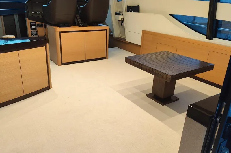 White Shark I Yacht Photos Pics Luxurious interior of a 2010 Pershing 72 yacht with modern furnishings and elegant design.