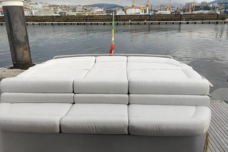 White Shark I Yacht Photos Pics Luxury seating on a 2010 Pershing 72 yacht, docked by the waterfront.