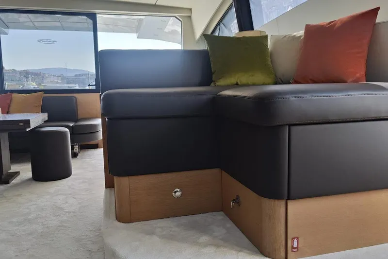 White Shark I Yacht Photos Pics Luxurious interior of 2010 Pershing 72 yacht with modern seating and colorful cushions.