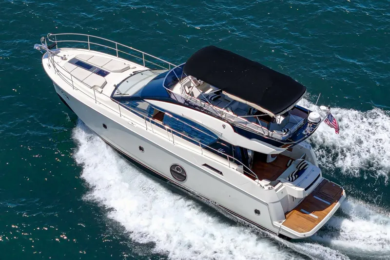 The Riviera Yacht Photos Pics 2017 Beneteau Monte Carlo 5 MC5 yacht cruising on open water.