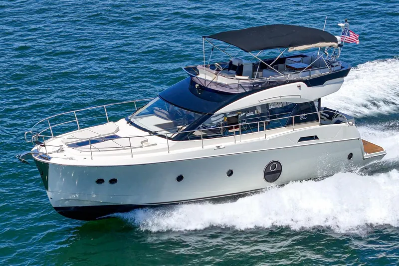 The Riviera Yacht Photos Pics 2017 Beneteau Monte Carlo 5 MC5 yacht cruising on open water.