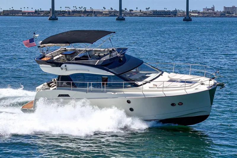 The Riviera Yacht Photos Pics 2017 Beneteau Monte Carlo 5 MC5 yacht cruising on open water.