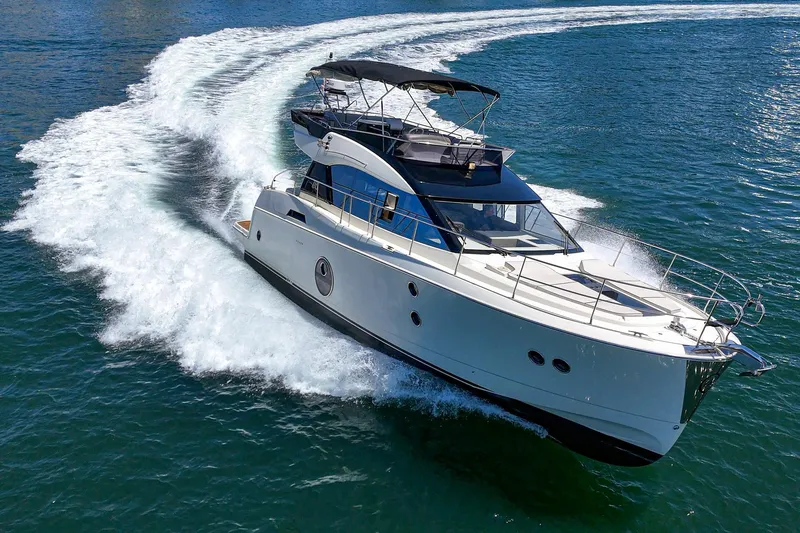 The Riviera Yacht Photos Pics 2017 Beneteau Monte Carlo 5 MC5 yacht cruising on open water.