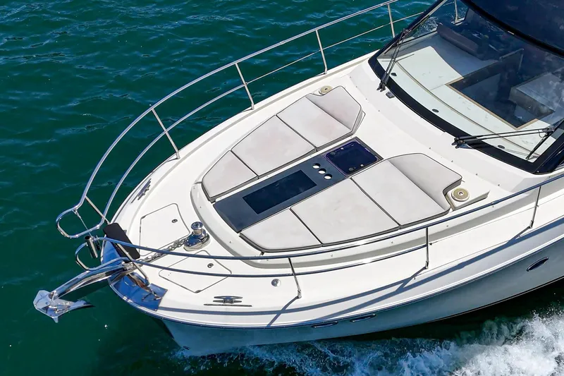 The Riviera Yacht Photos Pics 2017 Beneteau Monte Carlo 5 MC5 yacht cruising on clear blue water.