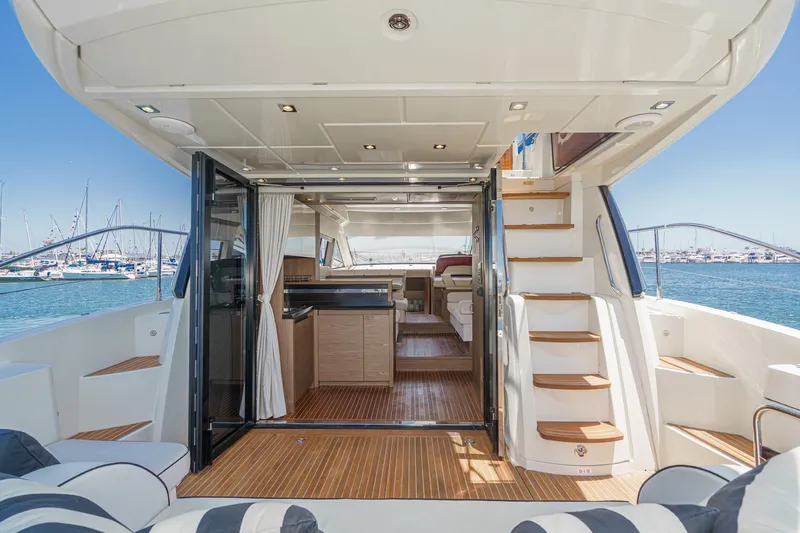 The Riviera Yacht Photos Pics 2017 Beneteau Monte Carlo 5 MC5 yacht interior with open deck, modern design, and ocean view.