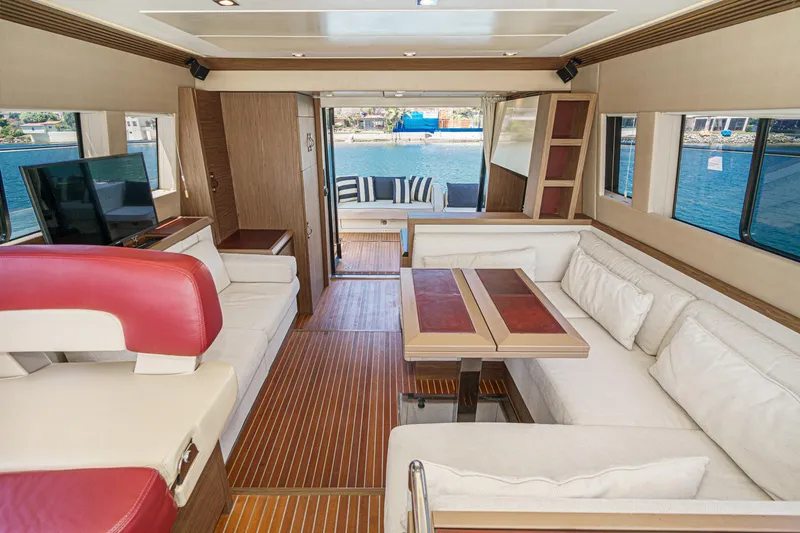 The Riviera Yacht Photos Pics Luxurious interior of 2017 Beneteau Monte Carlo 5 MC5 yacht with elegant seating and wood finishes.
