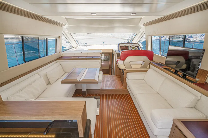 The Riviera Yacht Photos Pics Luxurious interior of 2017 Beneteau Monte Carlo 5 MC5 yacht with elegant seating and helm.