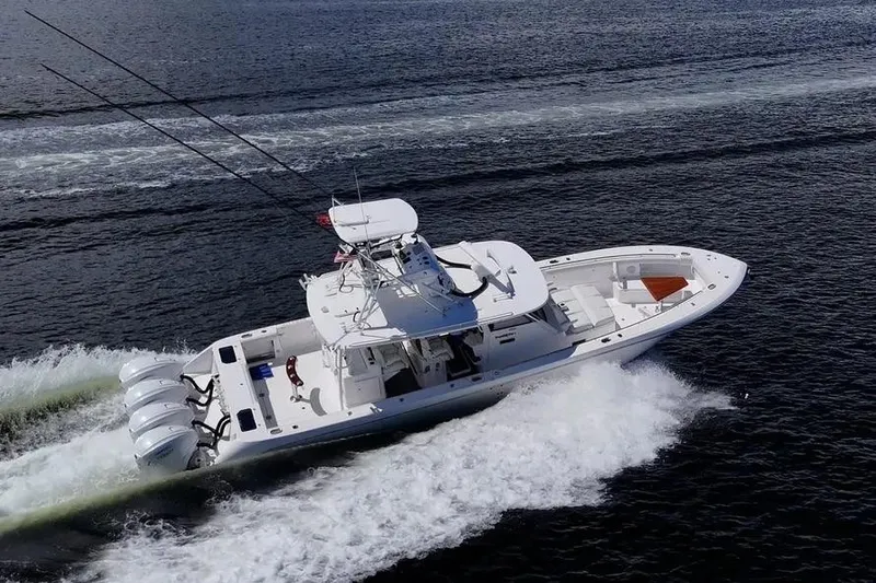  Yacht Photos Pics 2019 Everglades 435 Center Console boat cruising on open water.