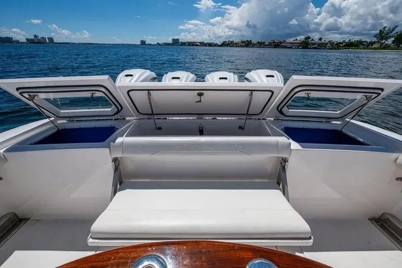  Yacht Photos Pics 2019 Everglades 435 Center Console boat with open storage compartments on a sunny day.