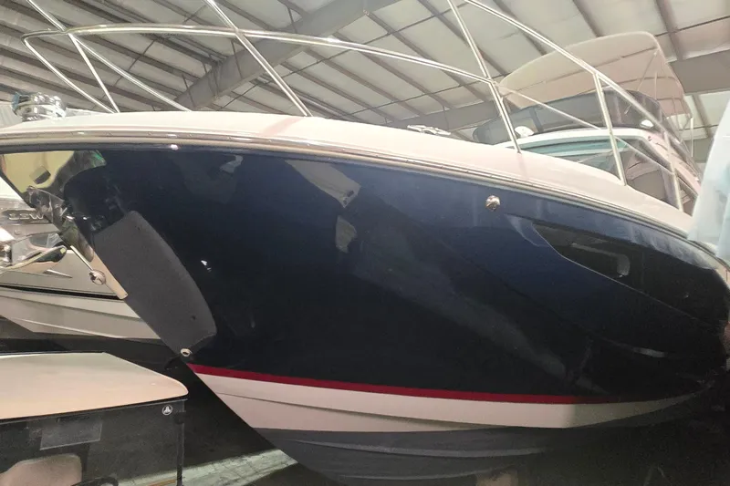 Your So Vein Yacht Photos Pics 2024 Regal 42 Fly yacht in a showroom, showcasing sleek design and modern features.