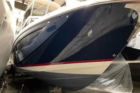 Your So Vein Yacht Photos Pics 2024 Regal 42 Fly yacht in storage, showcasing sleek blue hull design.
