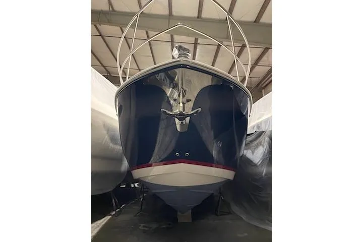 Your So Vein Yacht Photos Pics 2024 Regal 42 Fly yacht in storage, front view, showcasing sleek design.