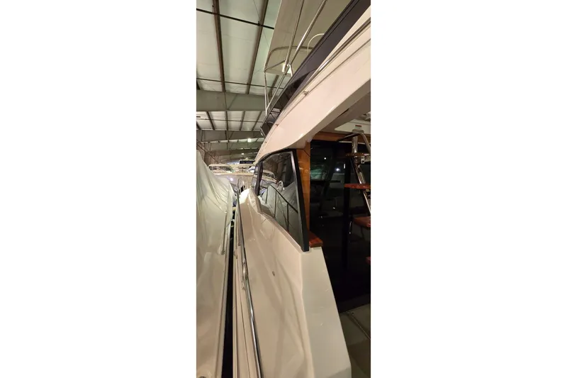 Your So Vein Yacht Photos Pics 2024 Regal 42 Fly yacht interior view in a showroom setting.