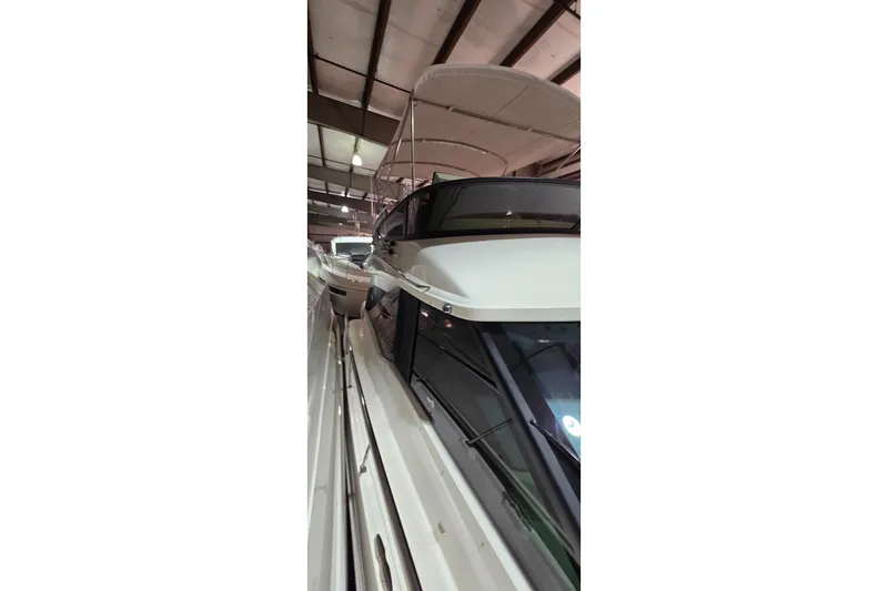 Your So Vein Yacht Photos Pics 2024 Regal 42 Fly yacht in indoor storage, showcasing sleek design and modern features.