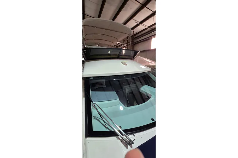 Your So Vein Yacht Photos Pics 2024 Regal 42 Fly yacht in a warehouse, showcasing sleek design and modern features.