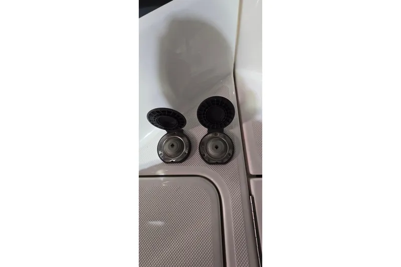 Your So Vein Yacht Photos Pics Fuel caps on a 2024 Regal 42 Fly boat deck, open and ready for refueling.
