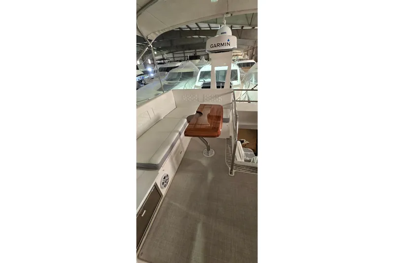 Your So Vein Yacht Photos Pics 2024 Regal 42 Fly yacht interior with seating and Garmin equipment.