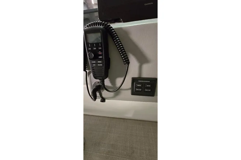 Your So Vein Yacht Photos Pics VHF radio and control panel on 2024 Regal 42 Fly yacht dashboard.