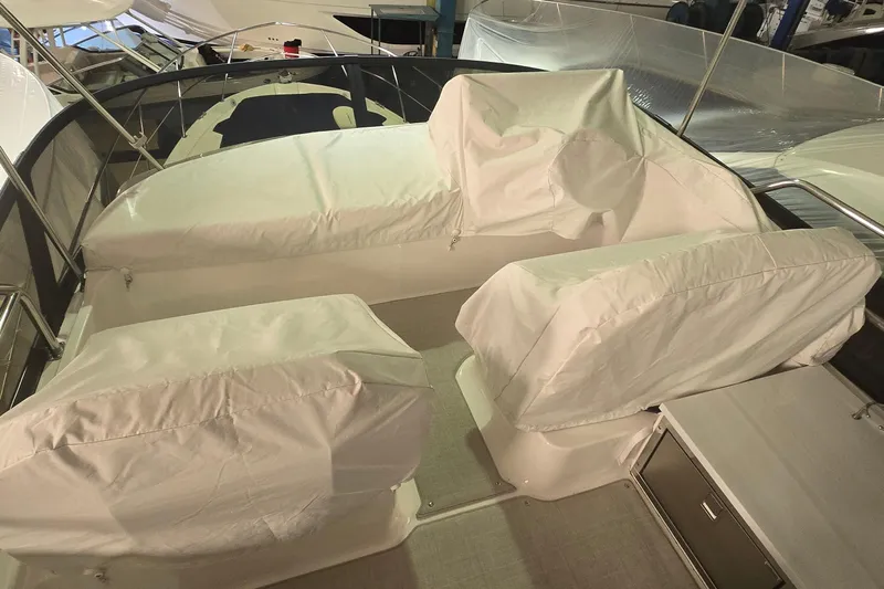 Your So Vein Yacht Photos Pics 2024 Regal 42 Fly yacht flybridge with covered seating area.