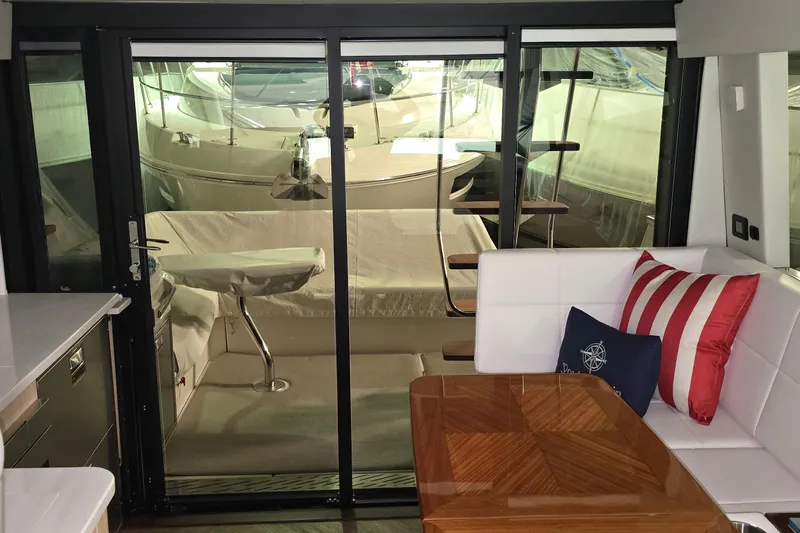 Your So Vein Yacht Photos Pics Interior of 2024 Regal 42 Fly yacht with modern seating and table.