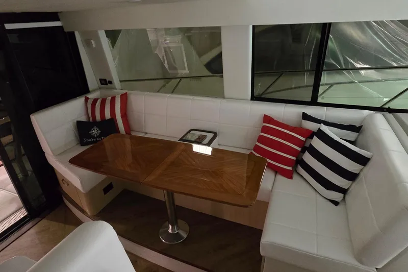 Your So Vein Yacht Photos Pics Luxurious interior of 2024 Regal 42 Fly yacht with elegant seating and striped cushions.