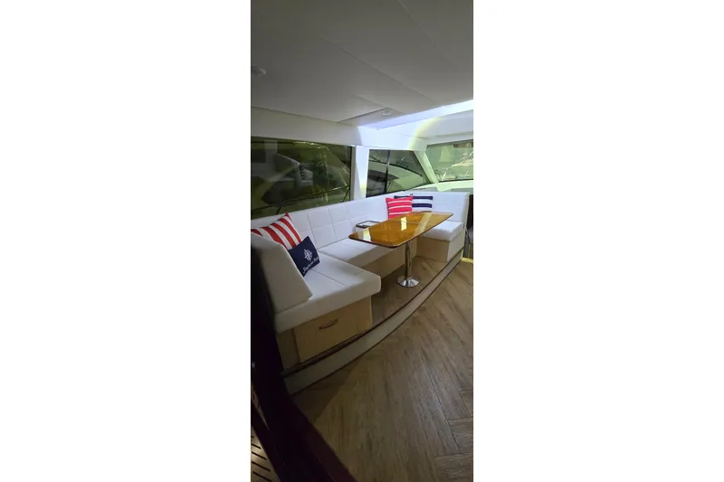 Your So Vein Yacht Photos Pics Luxurious interior of 2024 Regal 42 Fly yacht with elegant seating and table.