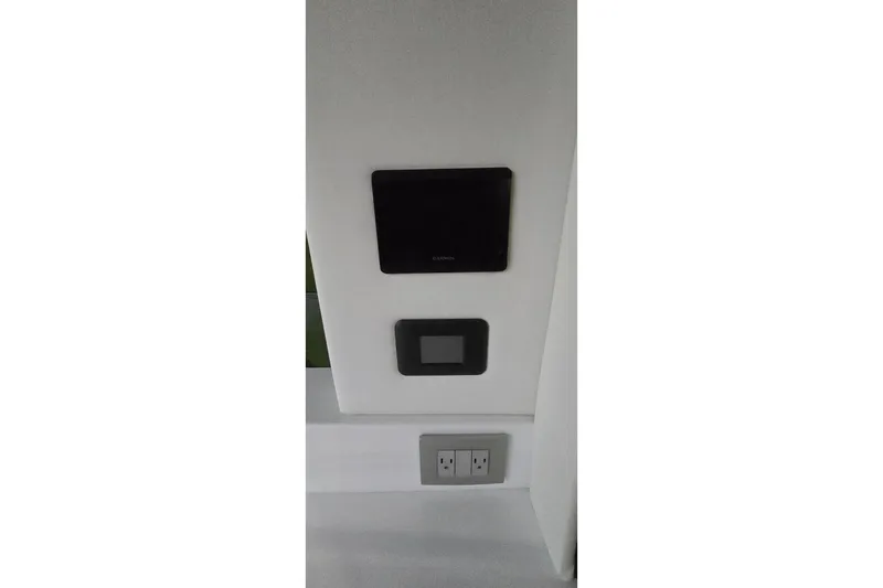 Your So Vein Yacht Photos Pics Control panel and outlets on 2024 Regal 42 Fly yacht interior wall.