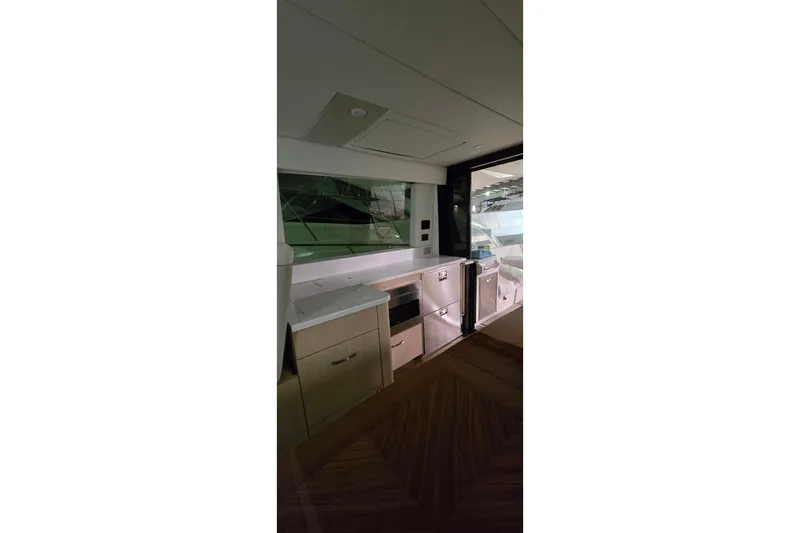 Your So Vein Yacht Photos Pics 2024 Regal 42 Fly yacht interior with modern kitchen and sleek cabinetry.