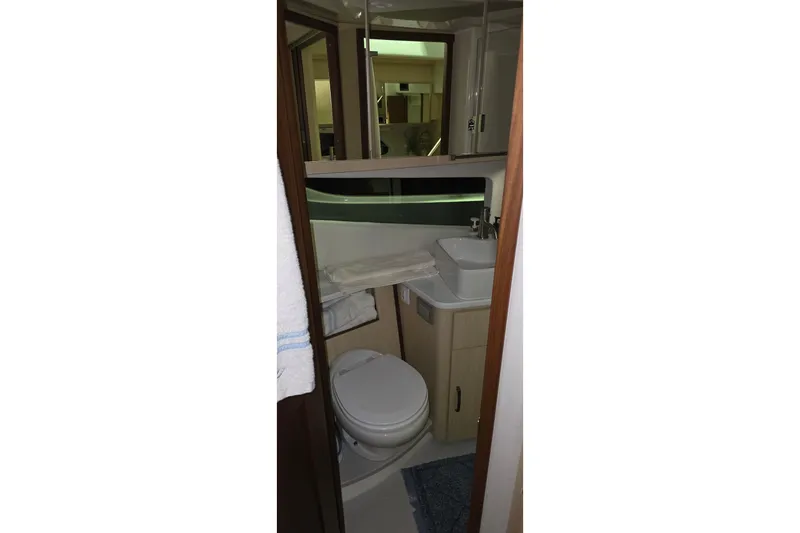 Your So Vein Yacht Photos Pics 2024 Regal 42 Fly yacht bathroom with modern fixtures and compact design.