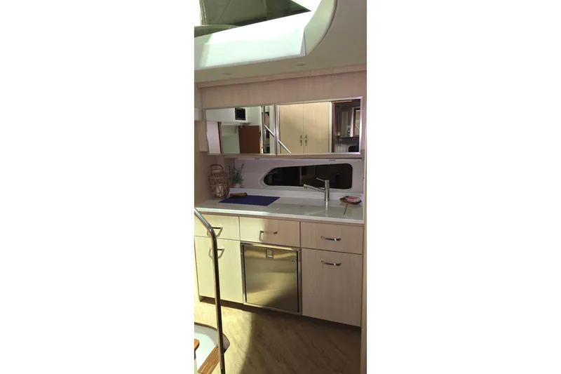 Your So Vein Yacht Photos Pics Modern kitchen interior of 2024 Regal 42 Fly yacht with sleek cabinetry and stainless steel appliances.