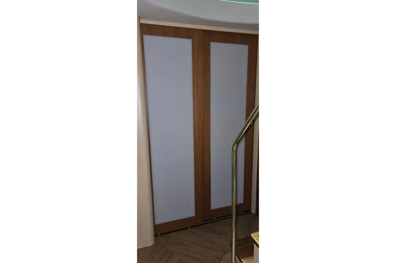 Your So Vein Yacht Photos Pics Wooden interior door on 2024 Regal 42 Fly yacht, near staircase.