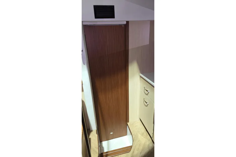 Your So Vein Yacht Photos Pics 2024 Regal 42 Fly yacht interior with wooden cabinetry and modern design.