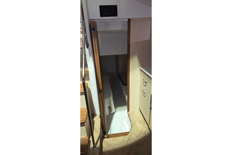 Your So Vein Yacht Photos Pics 2024 Regal 42 Fly yacht interior with open closet and wooden cabinetry.