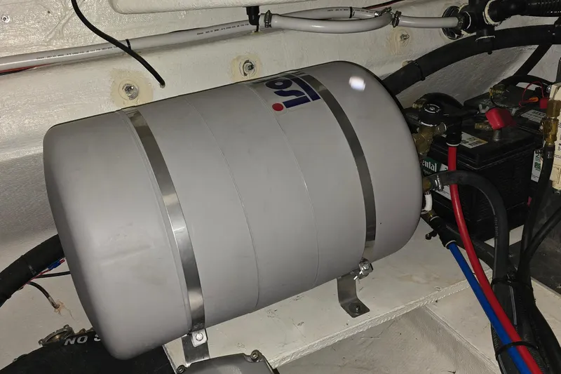 Your So Vein Yacht Photos Pics Engine room of 2024 Regal 42 Fly yacht with water heater and battery.