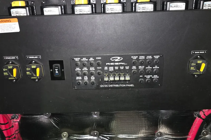 Your So Vein Yacht Photos Pics 2024 Regal 42 Fly 12V DC distribution panel with switches and circuit breakers.
