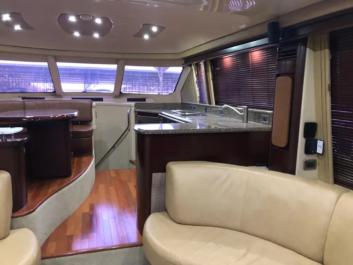 Cashed Out Yacht Photos Pics Luxurious interior of 2006 Sea Ray 58 Sedan Bridge yacht with modern furnishings.