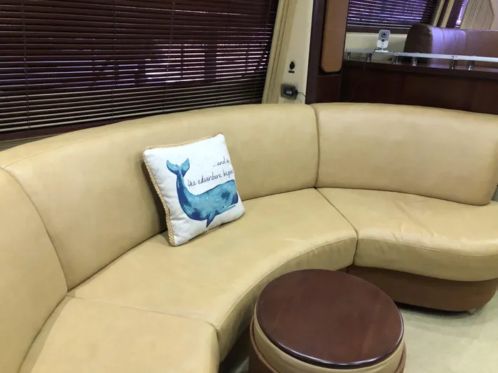 Cashed Out Yacht Photos Pics Luxurious beige leather seating in 2006 Sea Ray 58 Sedan Bridge yacht interior.