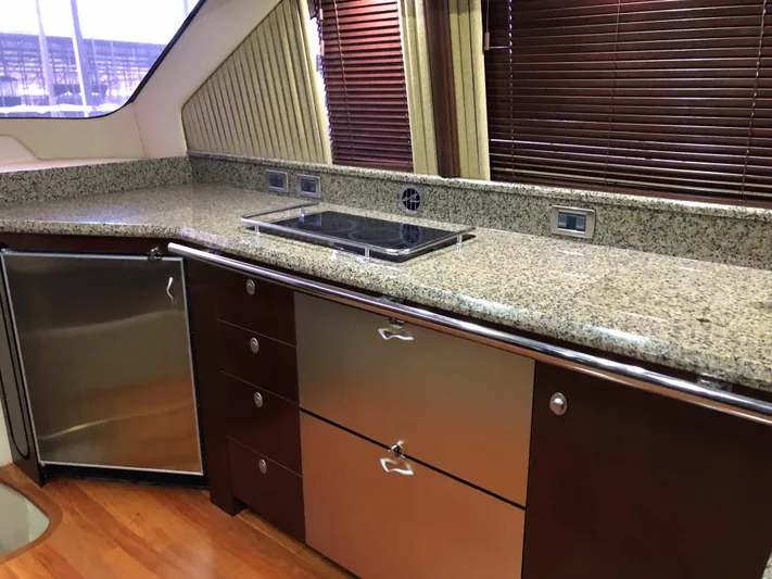 Cashed Out Yacht Photos Pics Luxurious kitchen interior of 2006 Sea Ray 58 Sedan Bridge yacht.