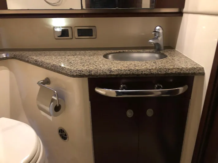 Cashed Out Yacht Photos Pics Luxurious bathroom in 2006 Sea Ray 58 Sedan Bridge yacht with granite countertop.
