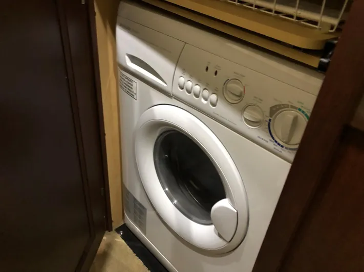 Cashed Out Yacht Photos Pics Washing machine inside 2006 Sea Ray 58 Sedan Bridge yacht cabin.