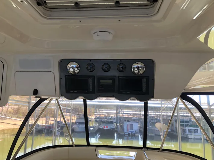 Cashed Out Yacht Photos Pics Interior view of 2006 Sea Ray 58 Sedan Bridge helm with gauges and controls.