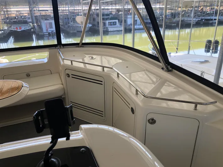 Cashed Out Yacht Photos Pics Interior view of 2006 Sea Ray 58 Sedan Bridge yacht with sleek cabinetry and seating.