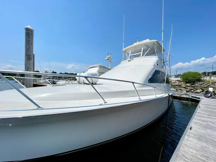  Yacht Photos Pics 2000 Ocean Yachts 43 Super Sport docked under clear blue sky.