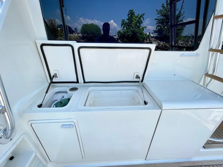  Yacht Photos Pics 2000 Ocean Yachts 43 Super Sport yacht deck with storage compartments open.