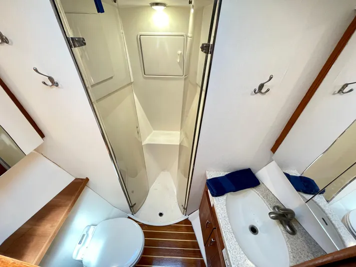  Yacht Photos Pics Bathroom interior of 2000 Ocean Yachts 43 Super Sport with shower and sink.