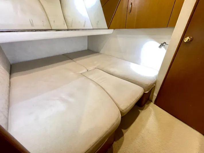  Yacht Photos Pics Interior cabin of 2000 Ocean Yachts 43 Super Sport with beige seating and wooden accents.