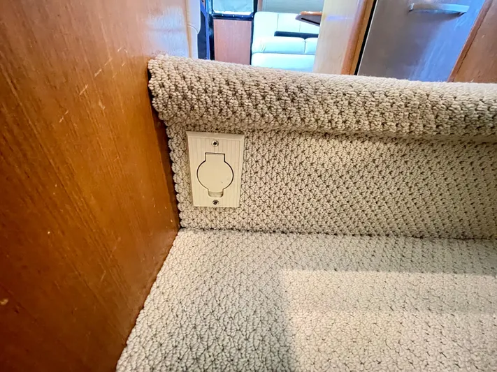  Yacht Photos Pics Carpeted stairs on 2000 Ocean Yachts 43 Super Sport, featuring a wall outlet.